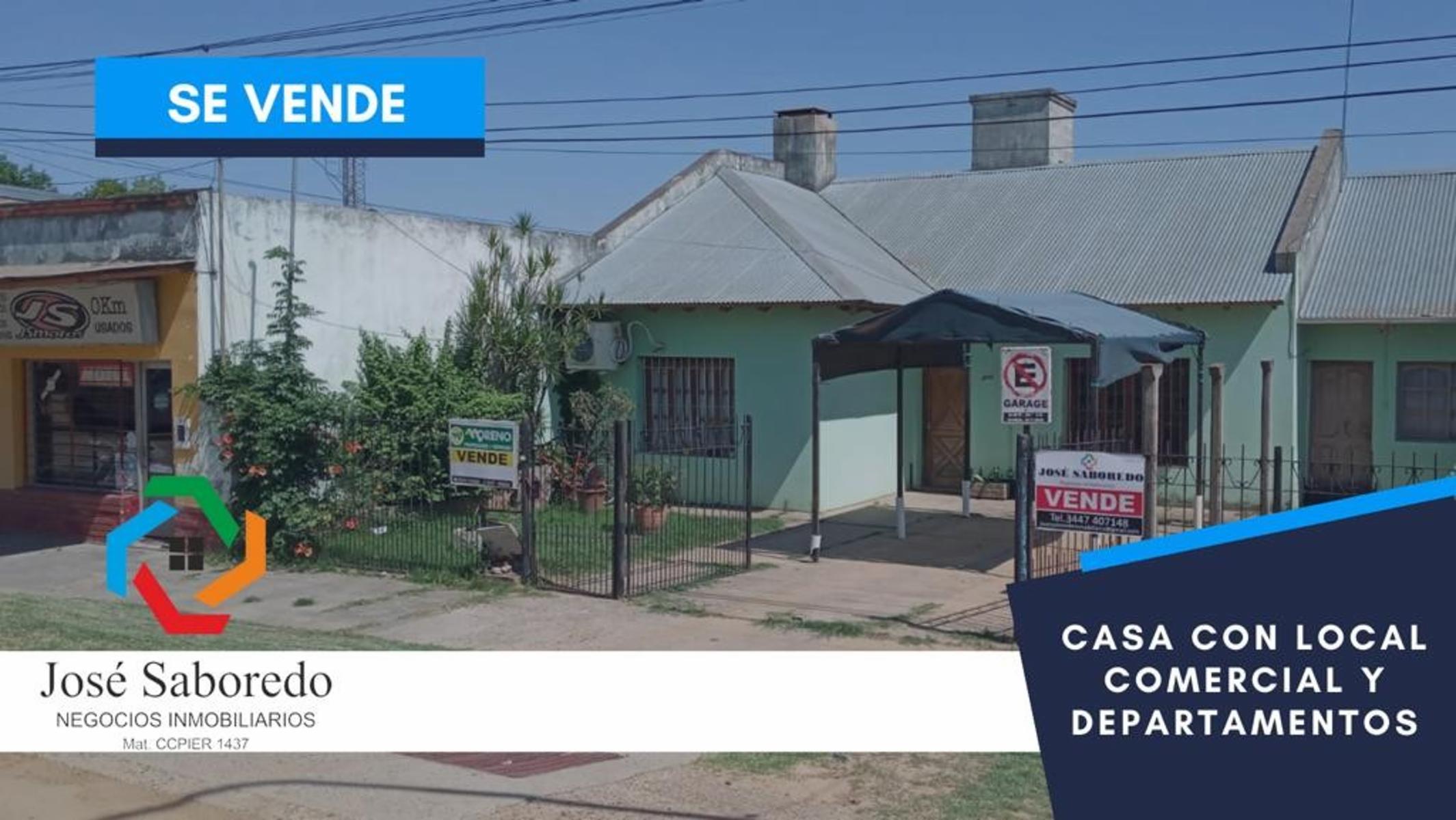 Casa con local comercial y un departamento.