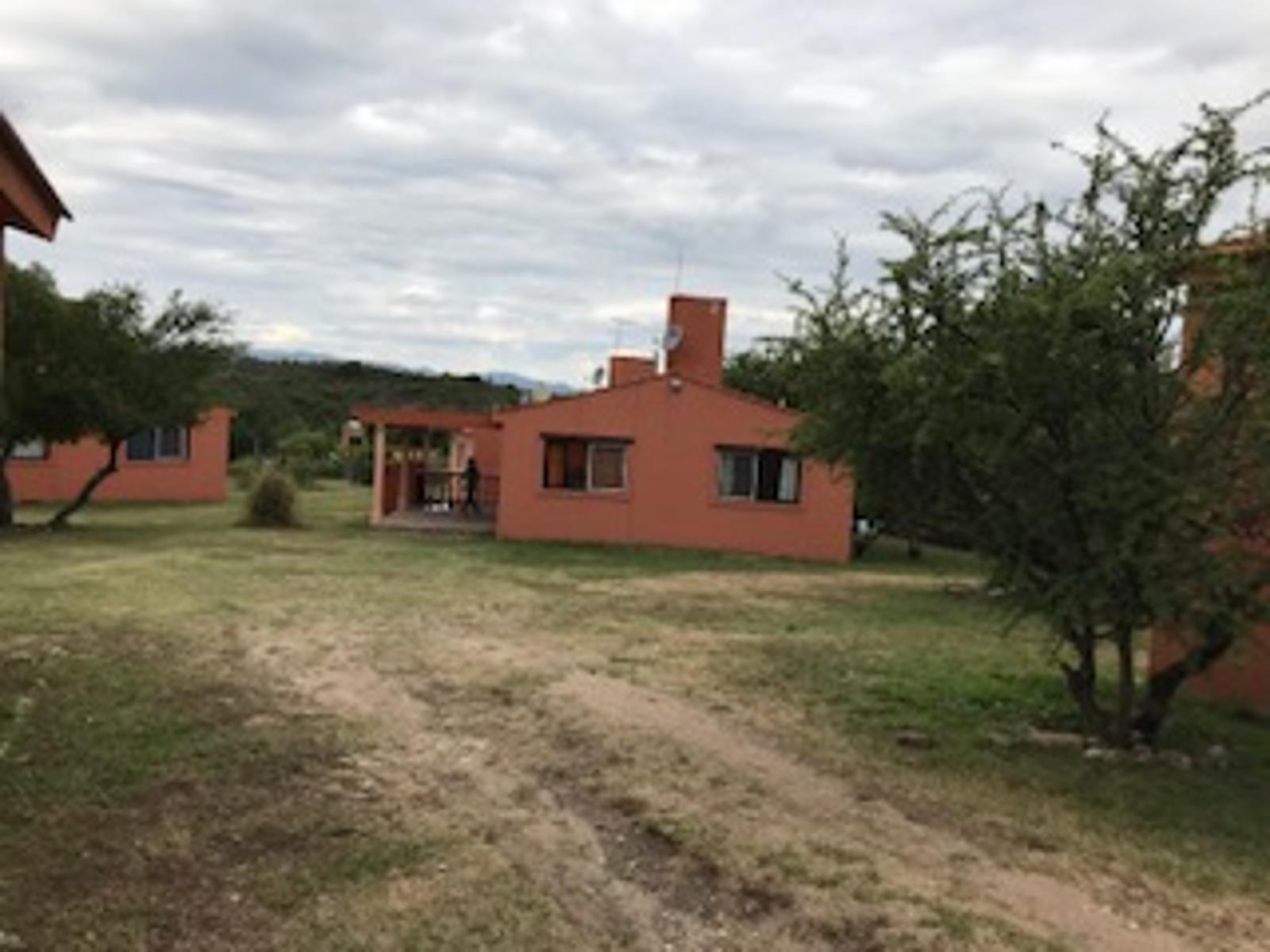 OPORTUNIDAD VENTA DE EXCELENTE COMPLEJO DE OCHO CABAÑAS EN CABALANGO - 1
