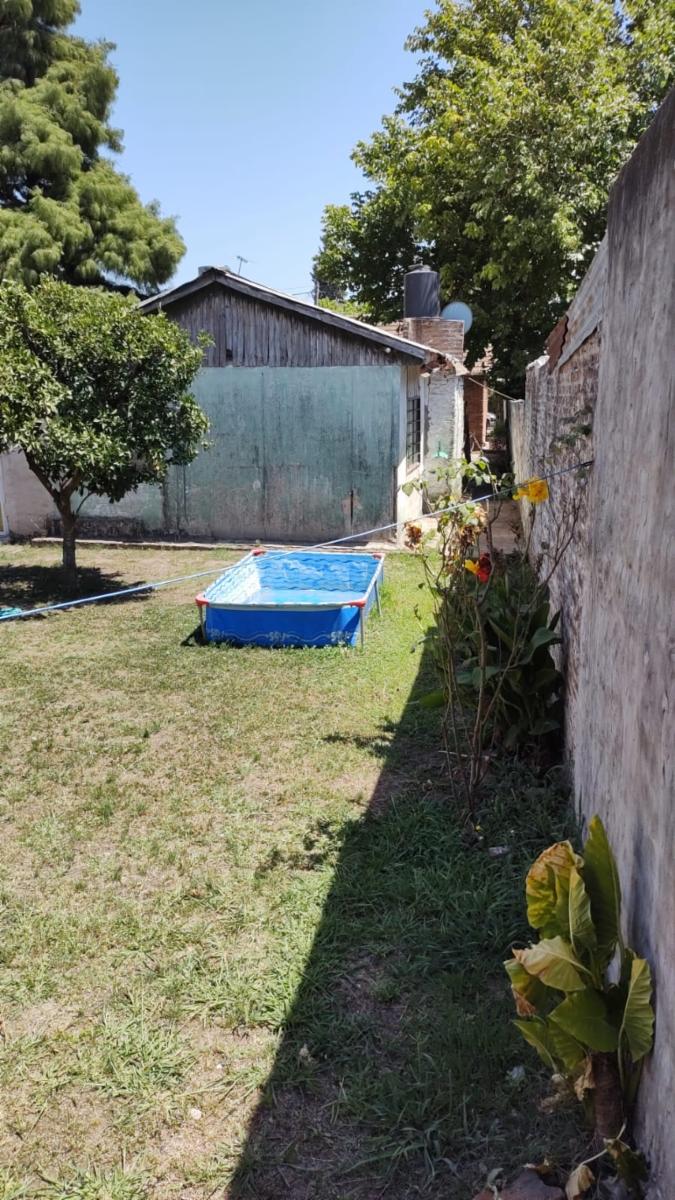 EXCELENTE PROPIEDAD MULTIFAMILIAR CON DOS VIVIENTDAS DE TRES AMBIENTES CON PATIO Y ENTRADA DE AUTOS Y TODOS LOS SERVICIOS — foto 7