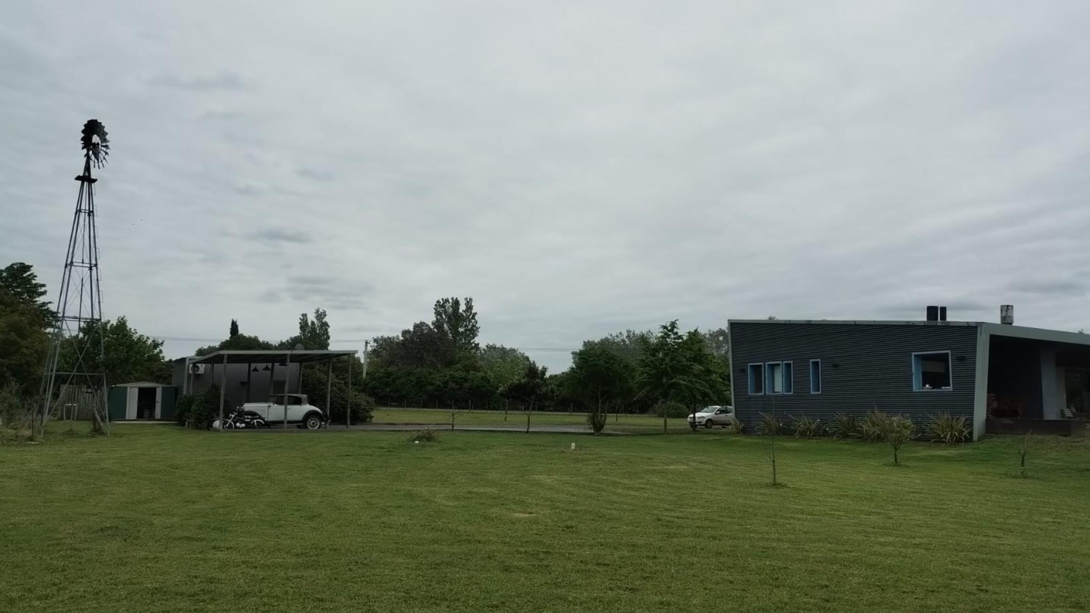 CASA EN CHACRA DE TRES HECTARIAS, VISTA PANORAMICA AL PARQUE GALERIA SEMICUBIERTA CON HORNO Y PARRILLA BODEGA EN SUBSUELO CANCHA DE PADLE VIDRIADA PISCINA Y POTRERO CON LAGO - 16