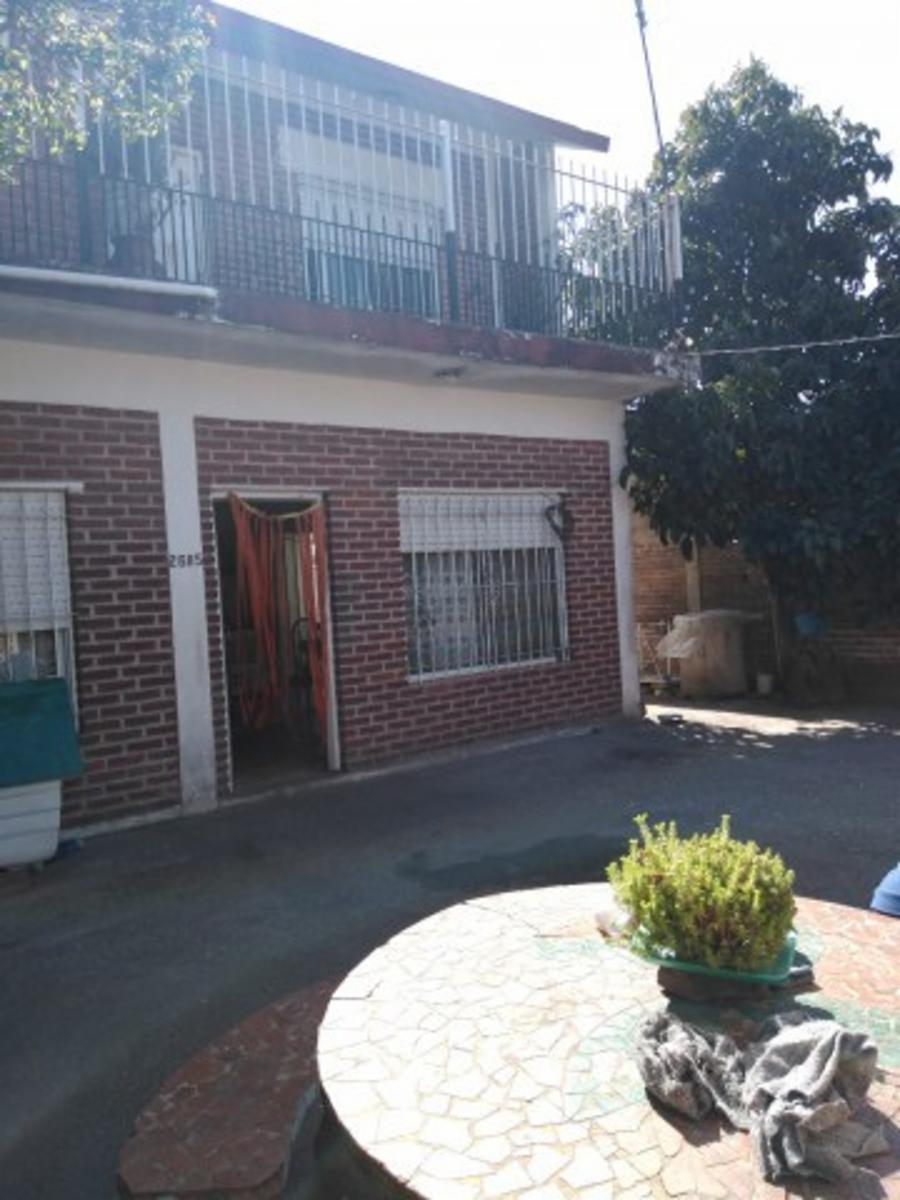 Retasado venta por viaje Casa con local barrio Monte Cudine — foto 2
