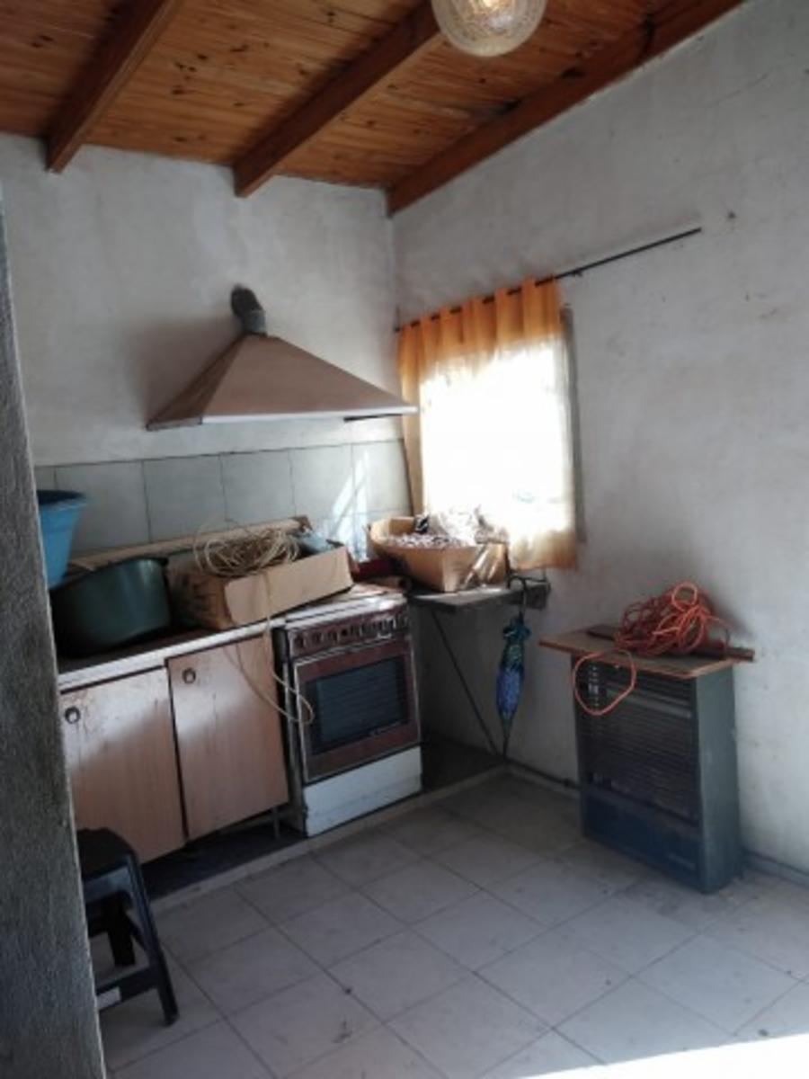 Retasado venta por viaje Casa con local barrio Monte Cudine — foto 6