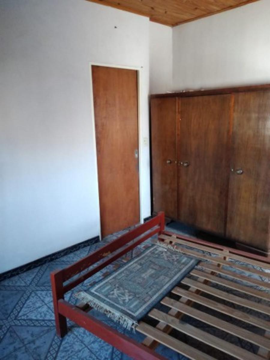 Retasado venta por viaje Casa con local barrio Monte Cudine — foto 10