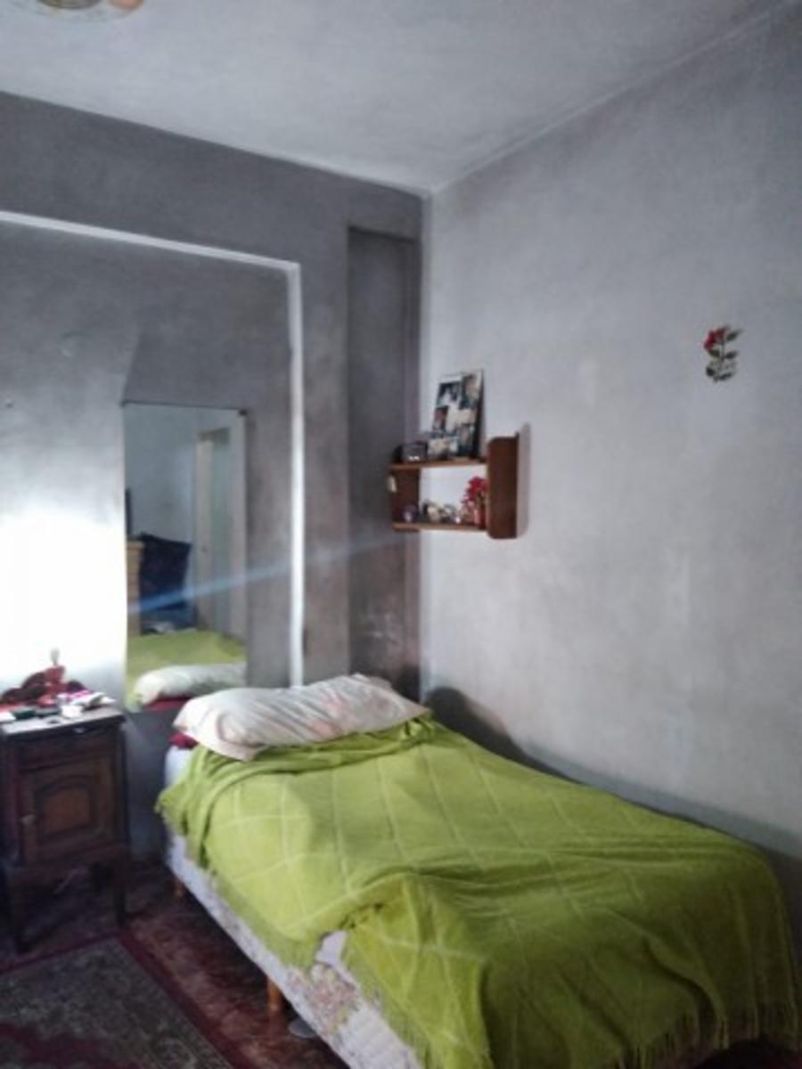 Retasado venta por viaje Casa con local barrio Monte Cudine — foto 11