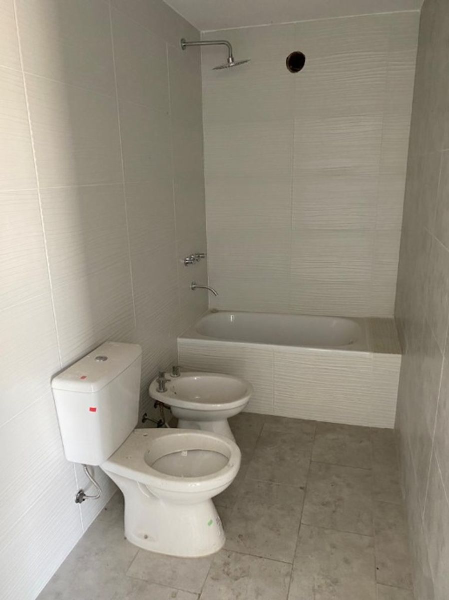 DEPARTAMENTO DE 2 AMBIENTES EN PLANTA BAJA CON COCHERA DESCUBIERTA - 9