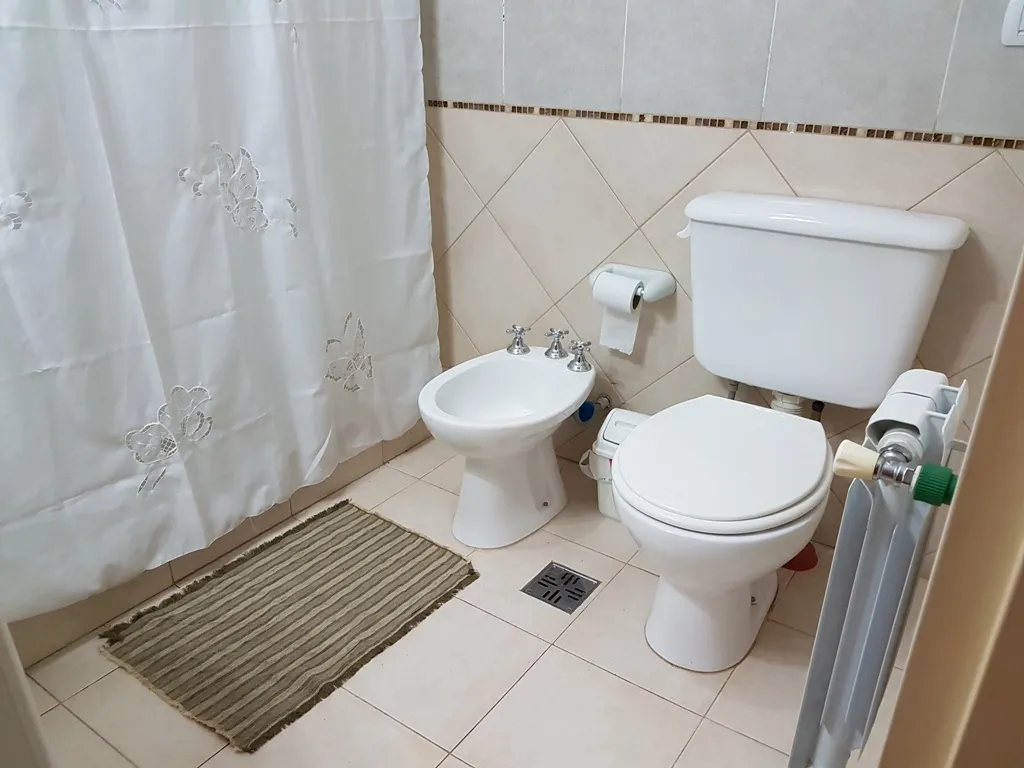 LINDO DEPARTAMENTO EN VILLA CARLOS PAZ, ALQUILER PERMANENTE A 2 AÑOS, EN COMPLEJO CON PILETA, QUINCHO ASADOR, Gas Natural. Calefacción central - 12